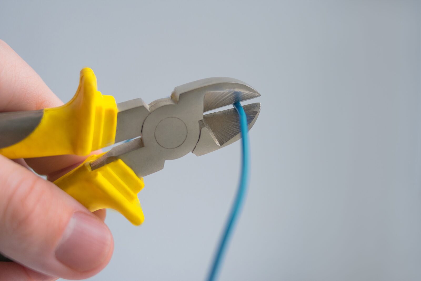 Pliers cutting an electrical wire
