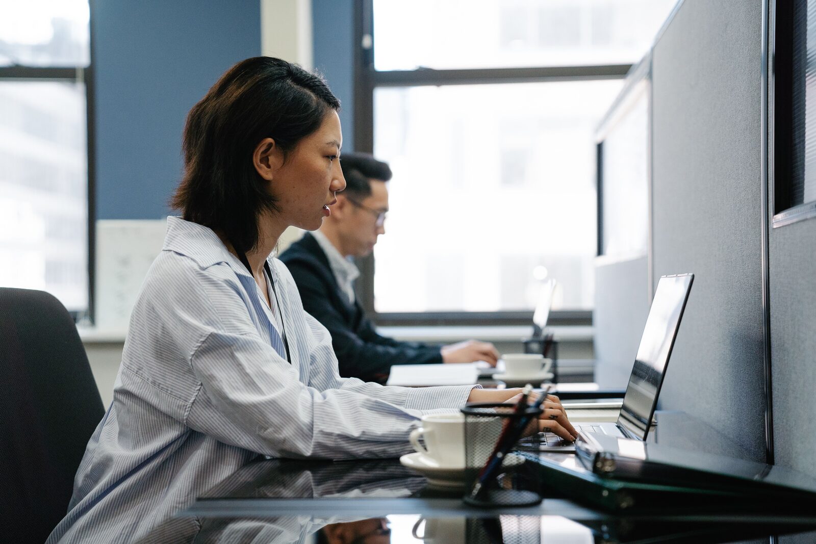 A woman working at a laptop